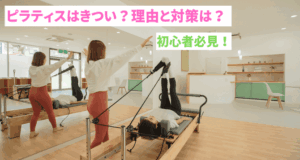 Woman and instructor doing reformer with both legs raised